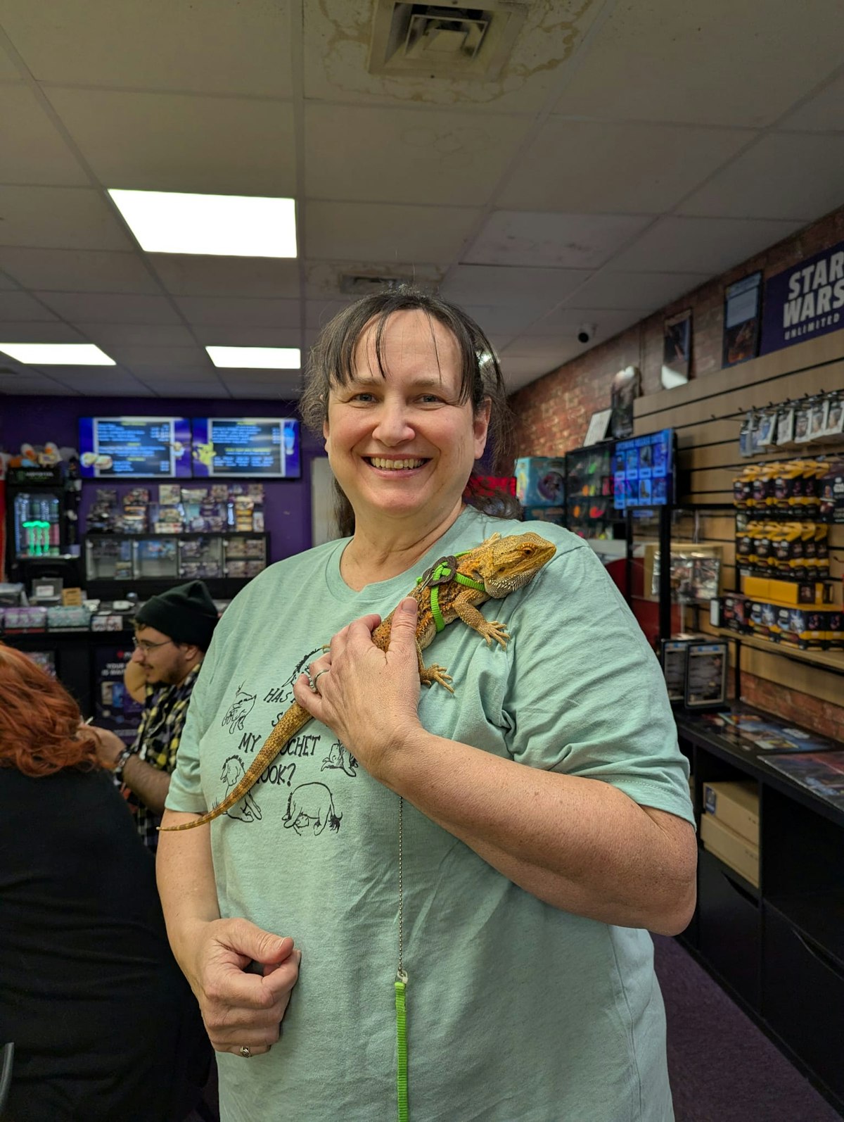 Sharon at Geek Retreat holding Dexter the Bearded Dragon